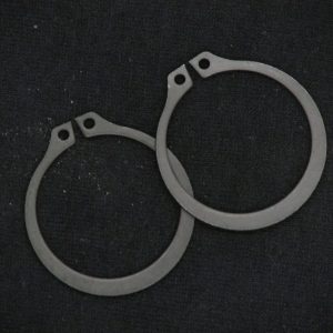 Metal karting brake caliper spacers for QRC Karts, precise racing parts.