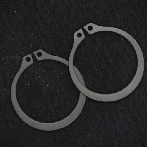 Metal karting brake caliper spacers for QRC Karts, precise racing parts.