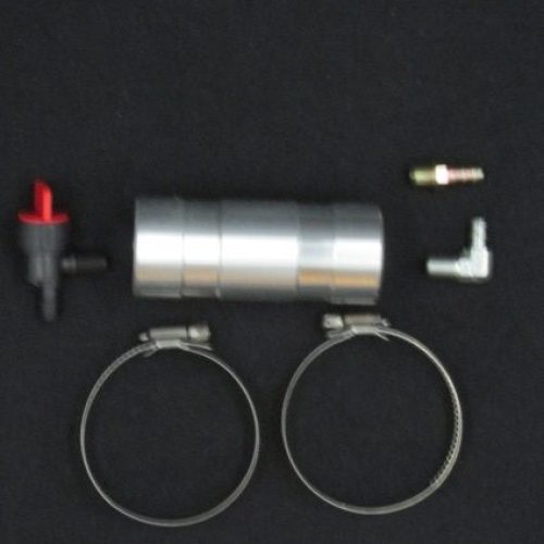 Close-up of metal engine components including clamps and fittings for go-kart engines.