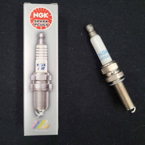 NGK spark plug and packaging for QRC Karts engines.