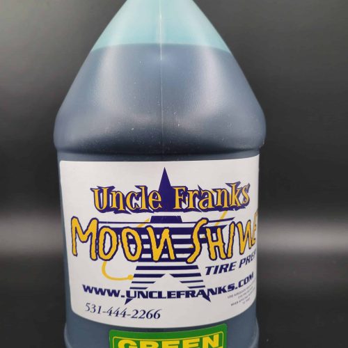 Bottle of Uncle Franks Tire Shine for go-kart tires, green label, shake well before use.